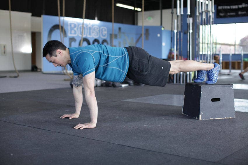 Feet-elevated push-up, position 1